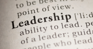 Close-up of a dictionary page with the word 'Leadership' in bold on the page surface.